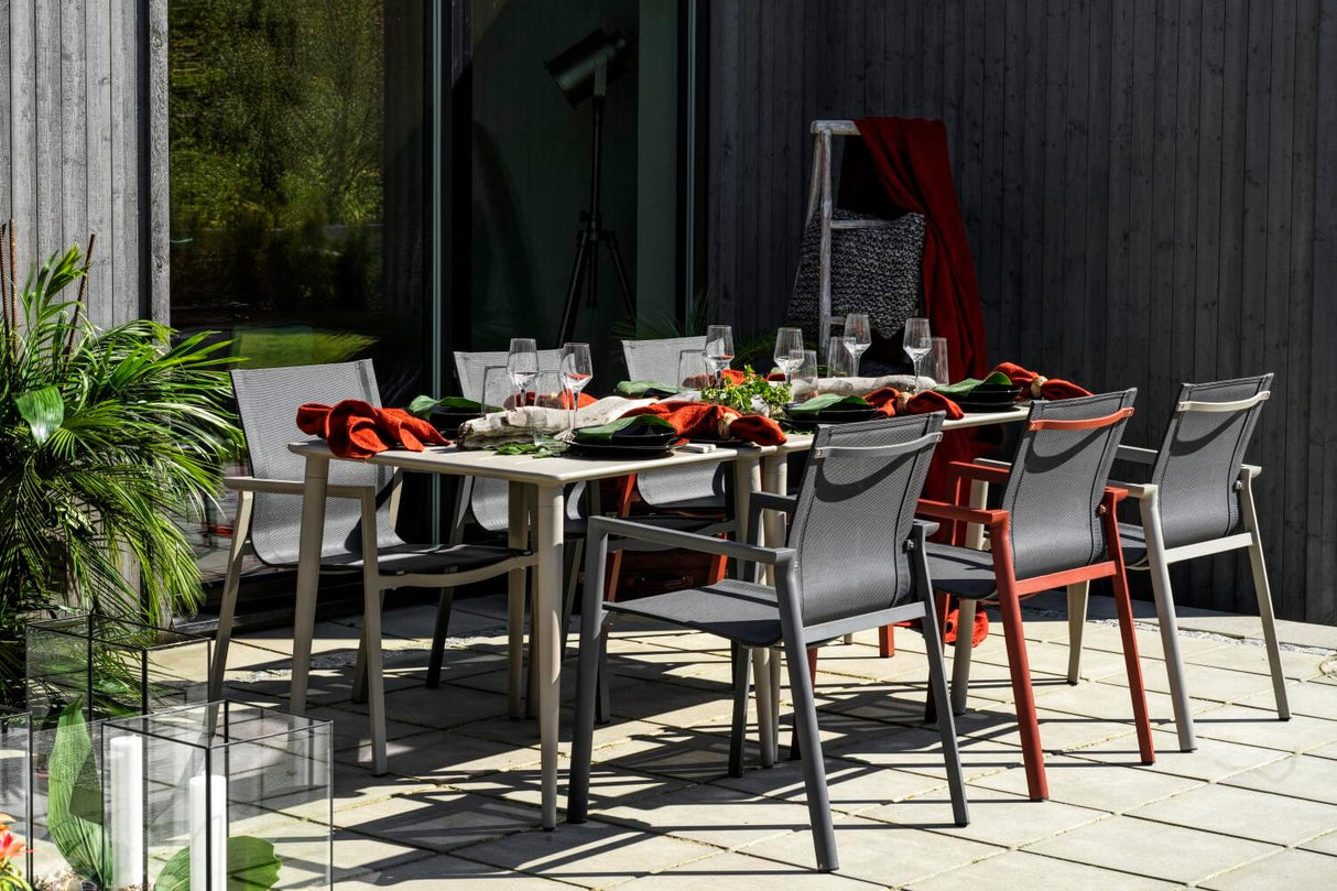 Delia stackable chair with armrest